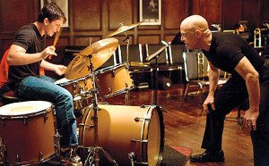 J.K. Simmons plays a jazz instructor inflicting tyrannical teaching methods on Miles Teller in Whiplash.